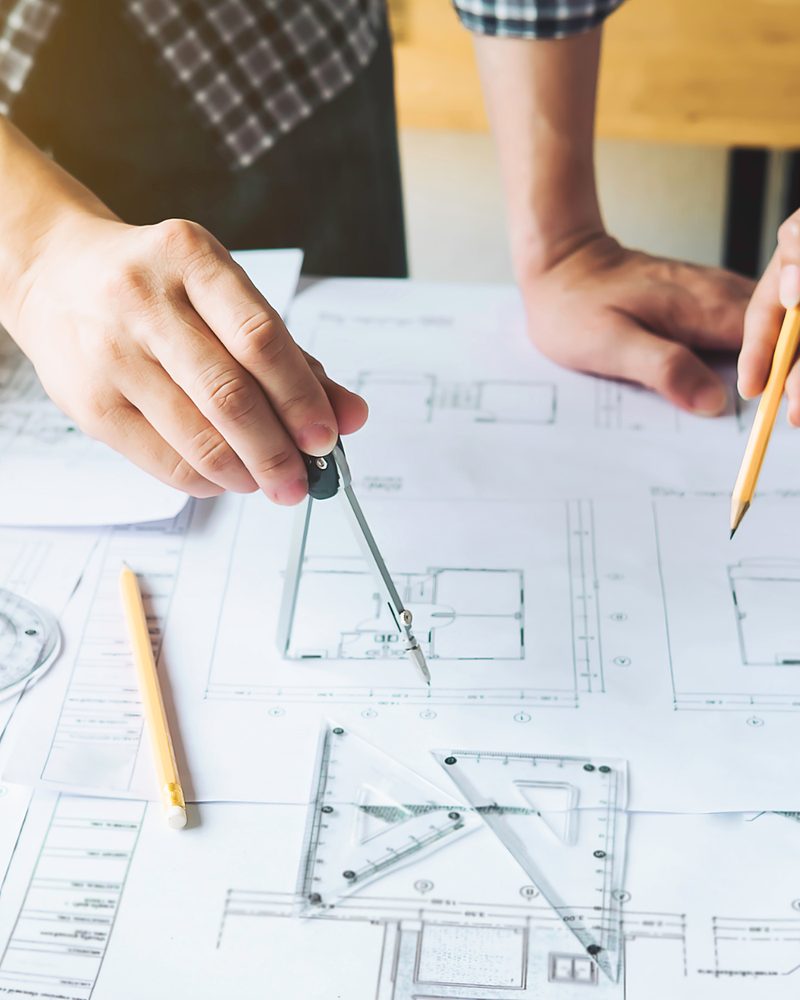 Building plans with a pencil and drafting tools